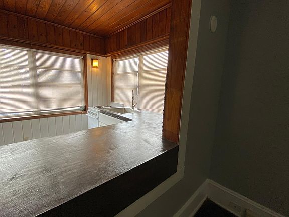 Breakfast bar opens into living room