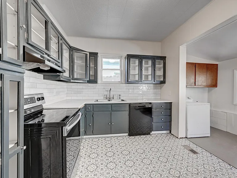 Vintage cabinets have been refreshed with a deep blue/green paint. Washer and Dryer included.