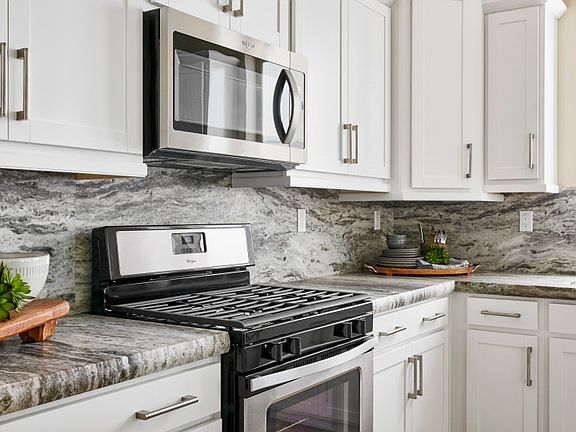 Upgrade your home with designer finishes and stainless-steel appliances throughout the kitchen.