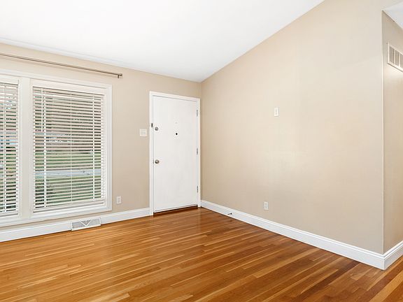 Living room is bright, tranquil, and open.