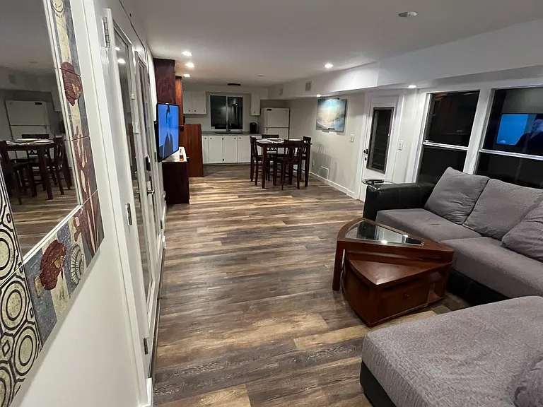 A look from the Primary Bedroom hallway toward the kitchen.