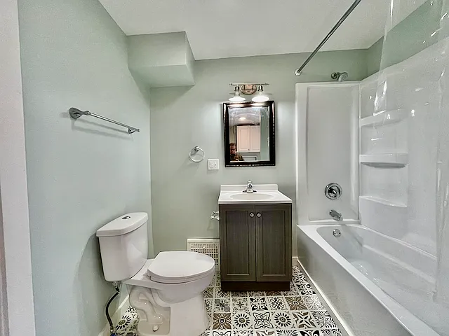 Updated bathroom with all new fixtures and flooring.