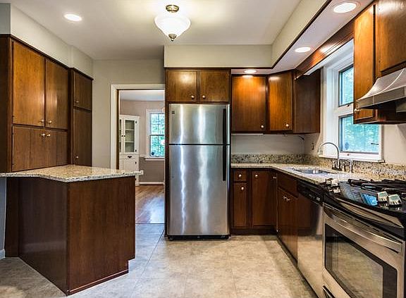 Stainless steel appliances & luxury vinyl tile