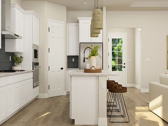 Stainless appliances are included in the kitchen