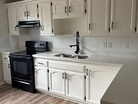 Freshly painted and remodeled kitchen offering a lot of cabinet and countertop space.