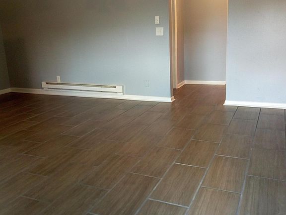 New Travertine tile throughout (living room).