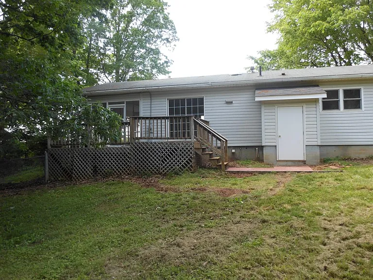 Deck on rear with storage closet for tools.