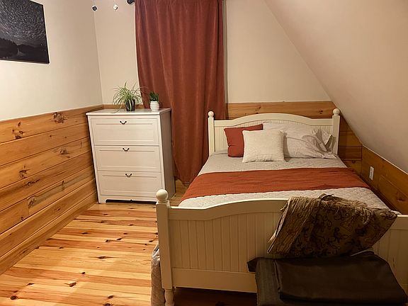 New full size bed and dresser and closet. Hardwood floors. Window looks over backyard. Shared bathroom. Third floor room and our family lives on the 1st and 2nd floors.