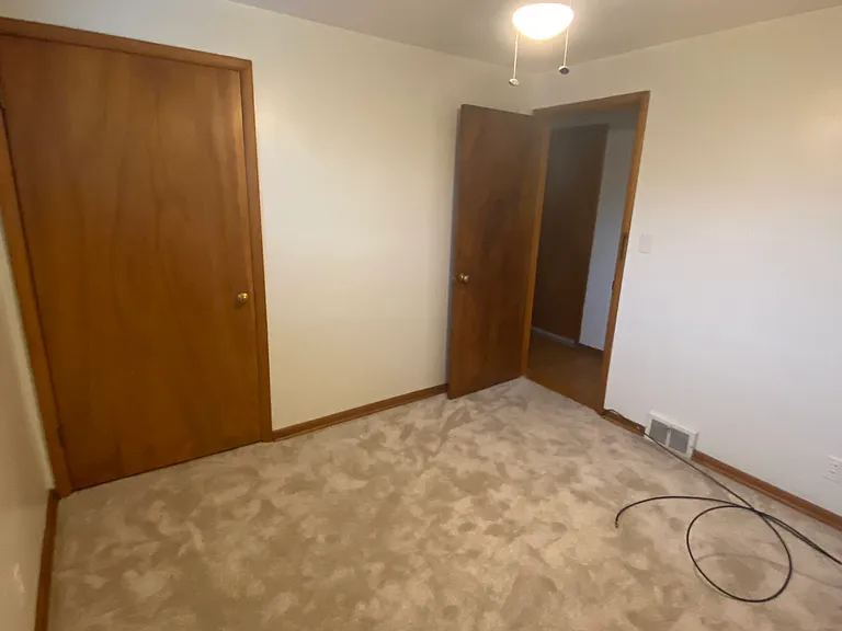1st Bedroom Showing Closet and Exit Doors
