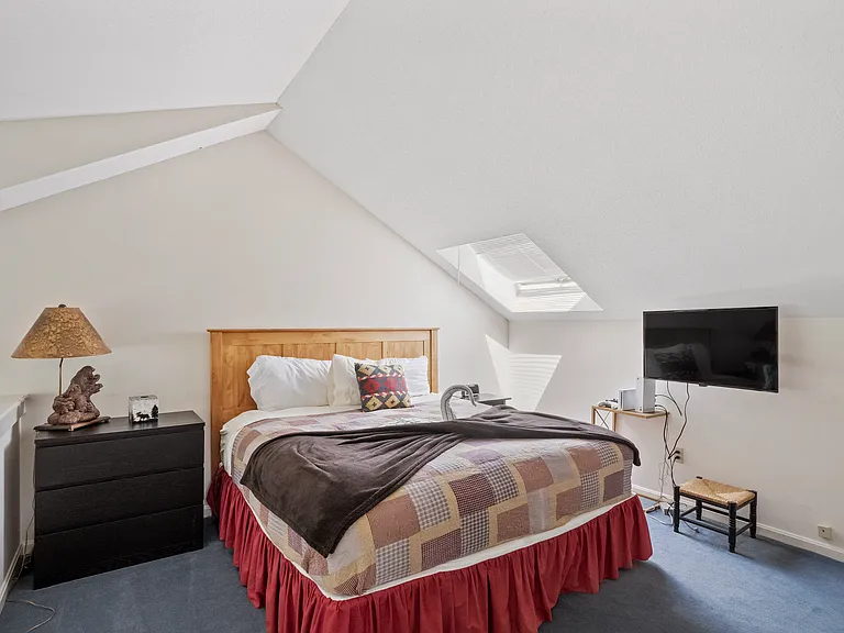 King size bed in loft area upstairs