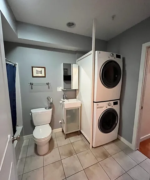 Bathroom with stacked washer/dryer.