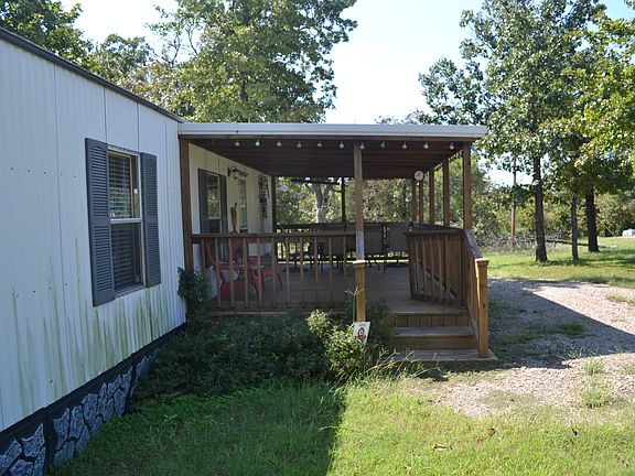 Large Covered Porch with a child gate.