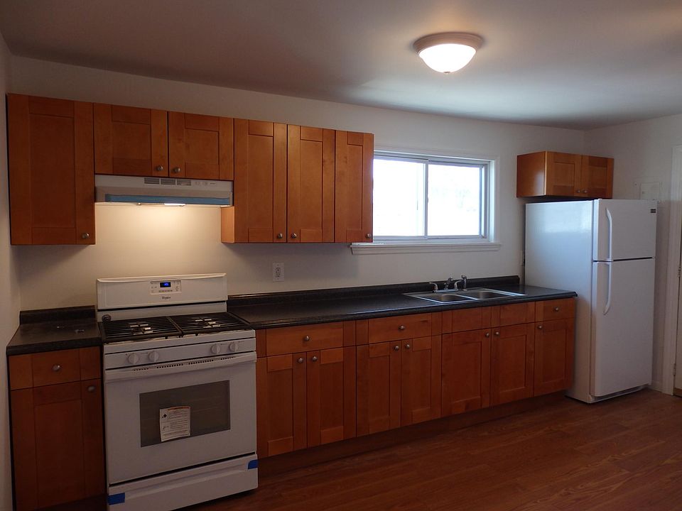 BEAUTIFUL HARDWOOD CUSTOM CABINETS AND NEW APPLIANCES