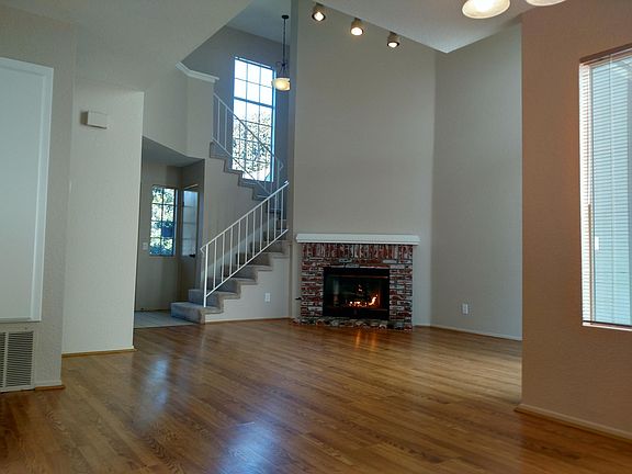 Main Room showing Stairs and Fireplace
