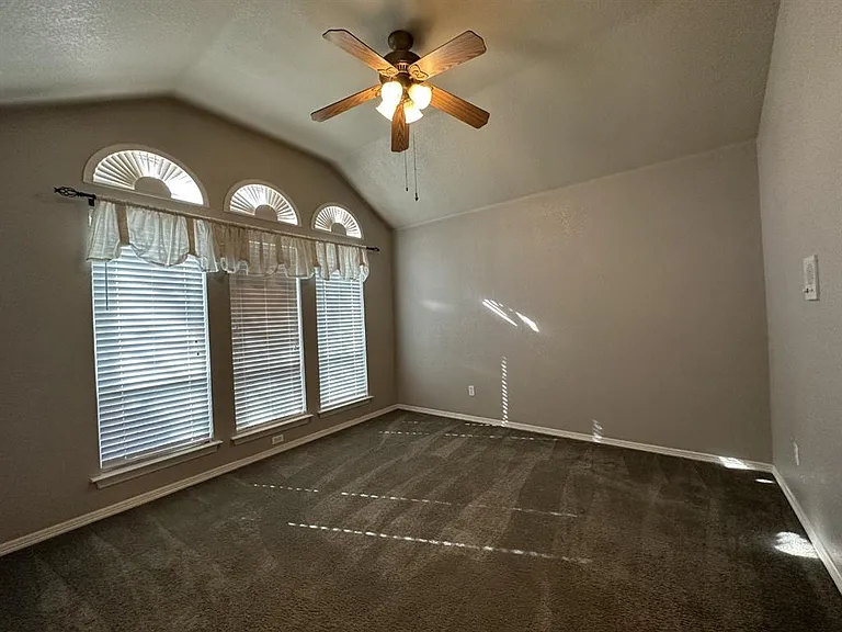 Just off the entry, the formal dining can also be used for home office or small game room.