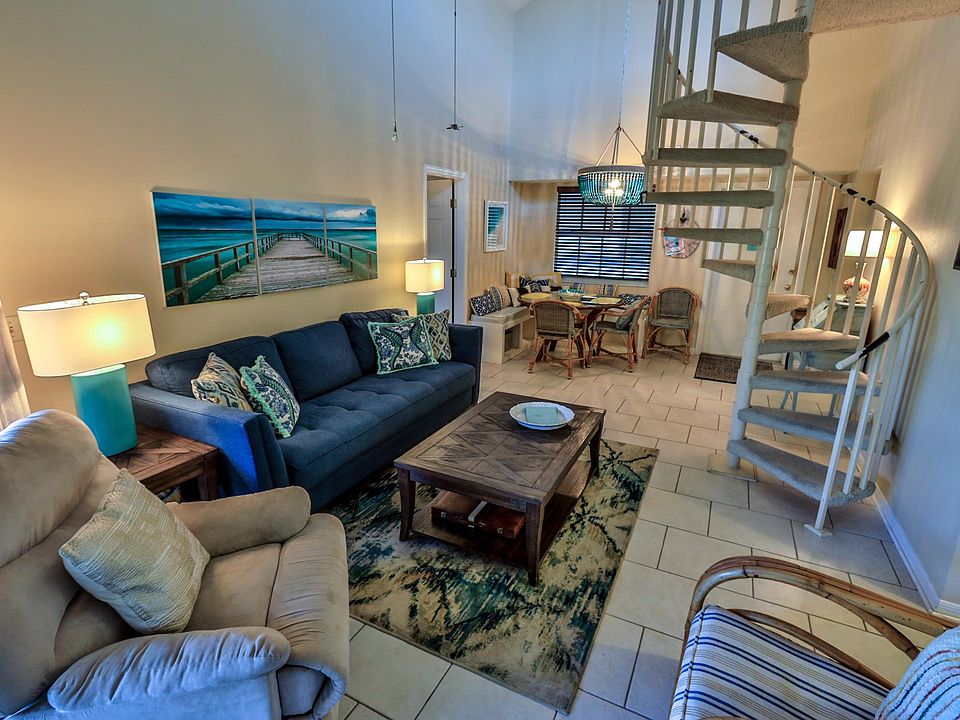 Living dining combo. Spiral staircase leads to the 3rd bedroom.