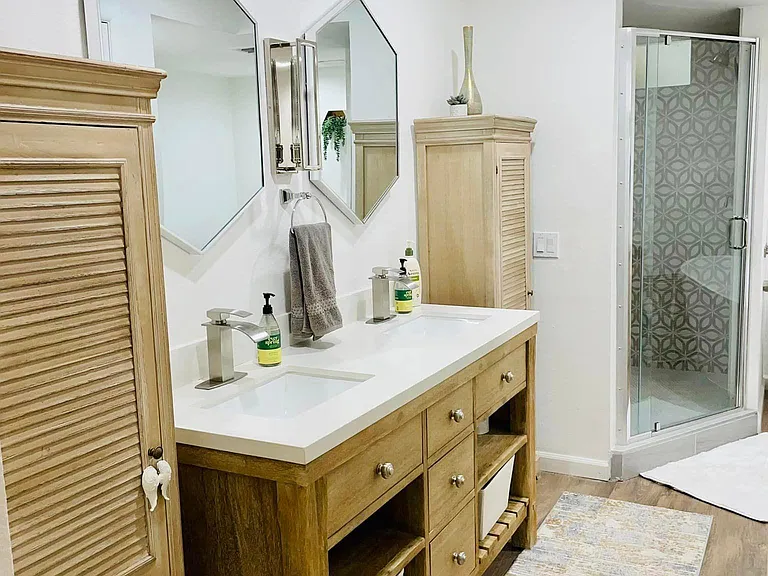 Master bathroom with walk-in shower. Cabinets included.