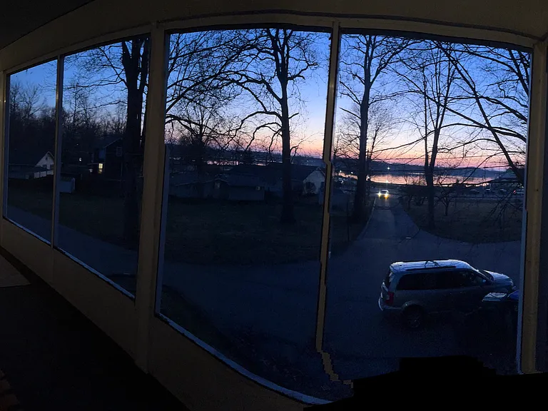 Screened-in porch view to Winona Lake