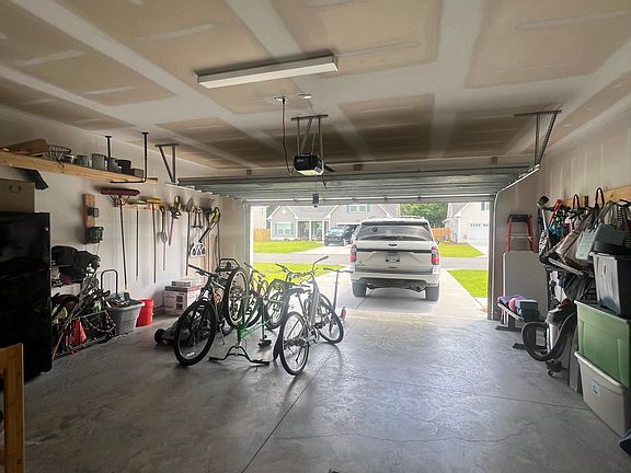 Two car garage - organization systems, utility room boasts ample storage