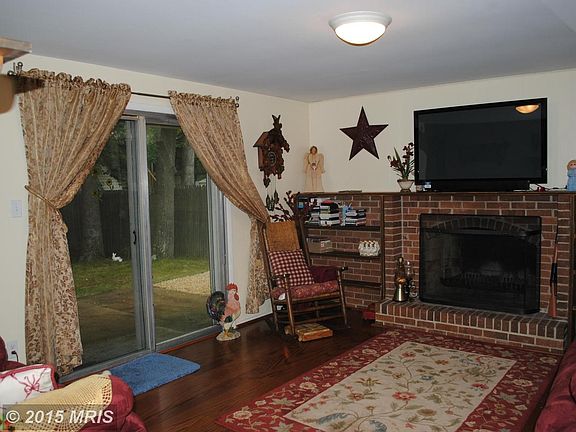 Family Room with brick fireplace and built-ins