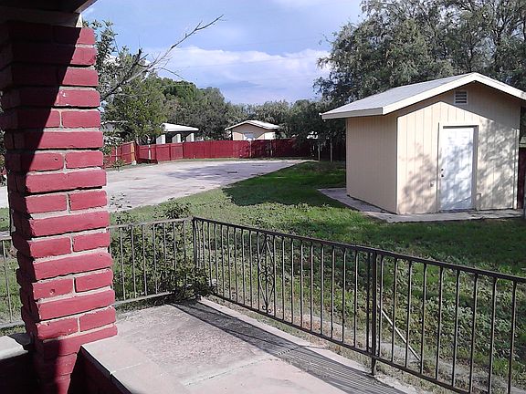 side of back yard - 2 sheds.