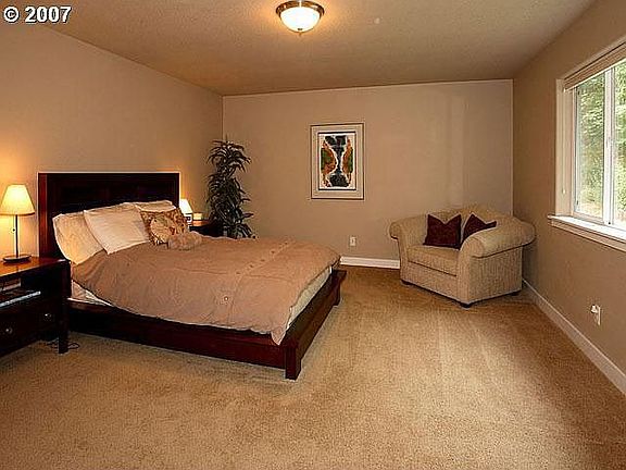 Spacious master suite with private forest view