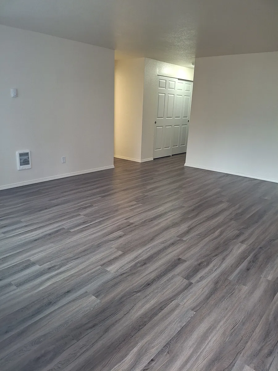 Large spacious living room. Flooring varies by floor plan. - GRAND OAK APARTMENTS