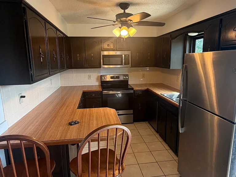 This is the kitchen waiting for you. Stainless steel appliances.