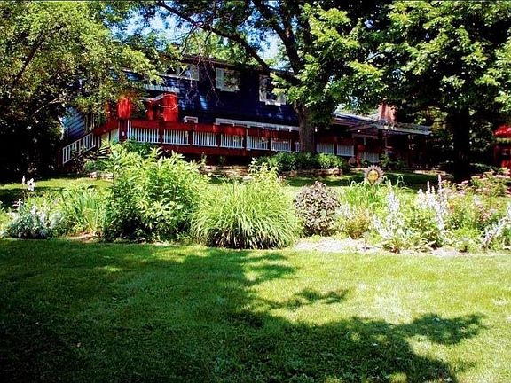 Backyard deck overlooks lakefront property