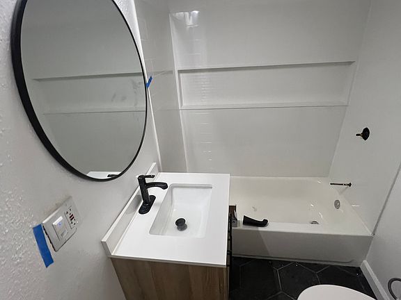 Fully flipped bathroom. New tile floors, new toilet, new vanity, new shower surround/tub/fixtures. Efficient color changing light + 800 CFM high efficiency fan.