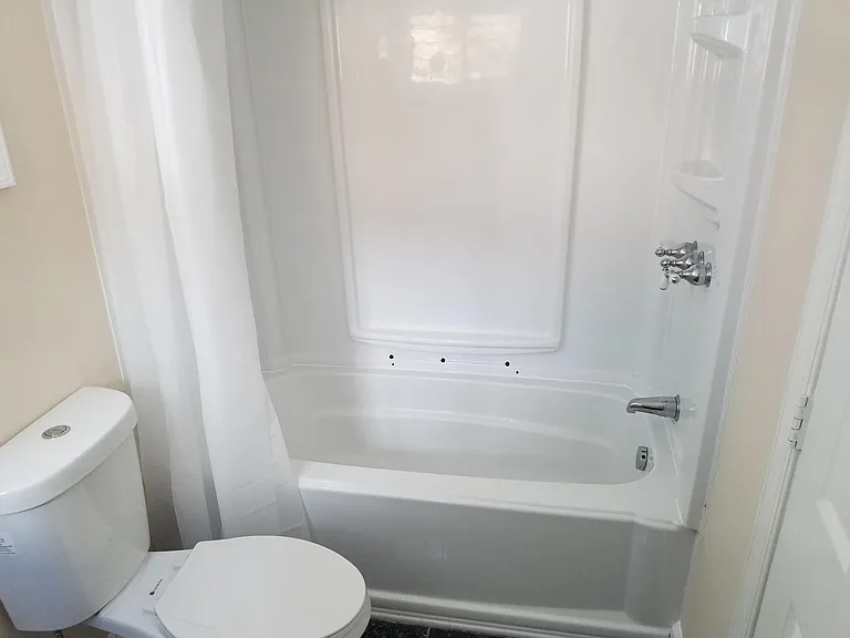 Bathroom tub and commode