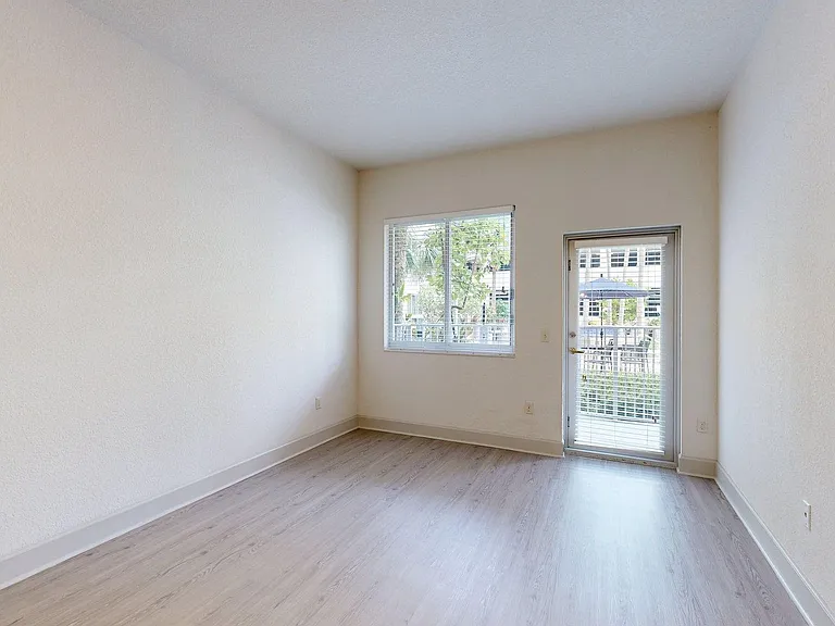 Apartment living room with wood style floor.