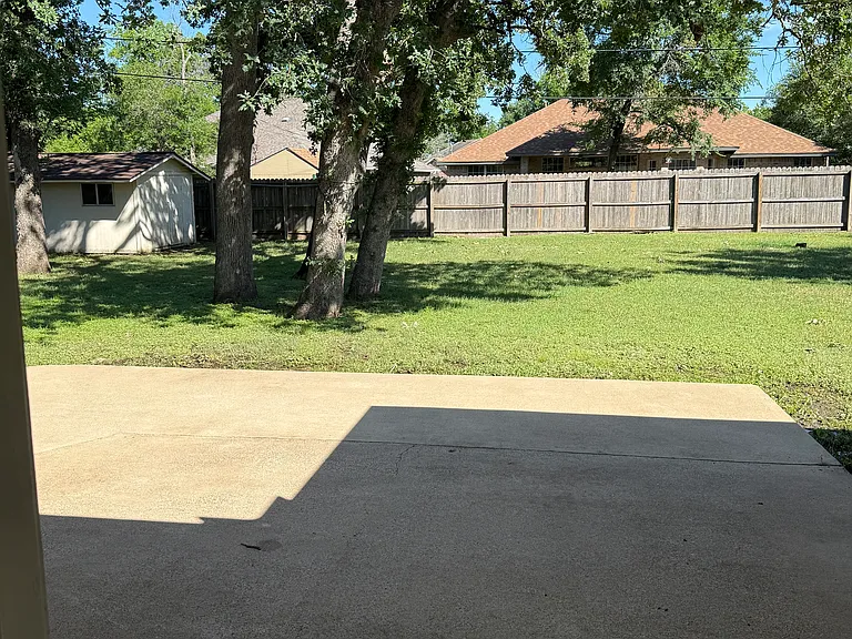 Back porch, fenced backyard, outdoor storage house