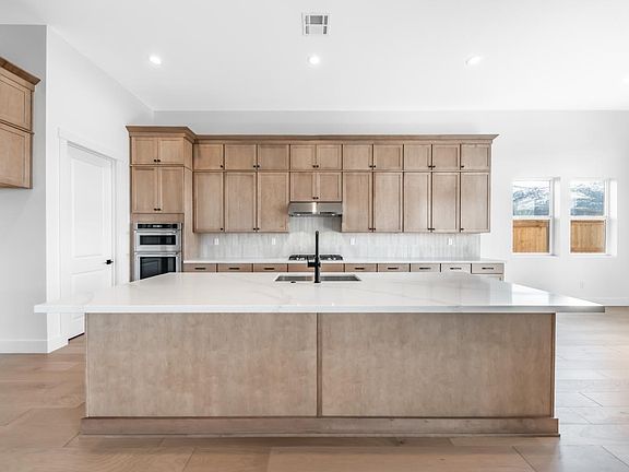 Well-equipped kitchen with beautiful cabinets and ample countertop space