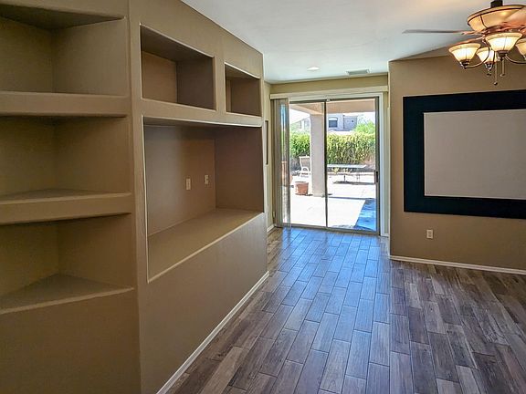 Living Room - Built-in entertainment center. Projector Screen - 100" - View Back Patio