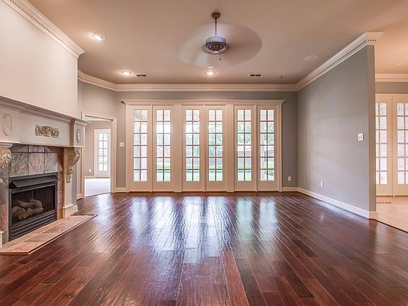 Family room overlooking covered patio and beautifully landscaped back yard. Adjacent to master suite which also opens to patio. Note the beautiful crown molding.