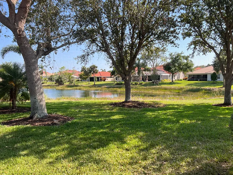 Shaded back yard with lake view