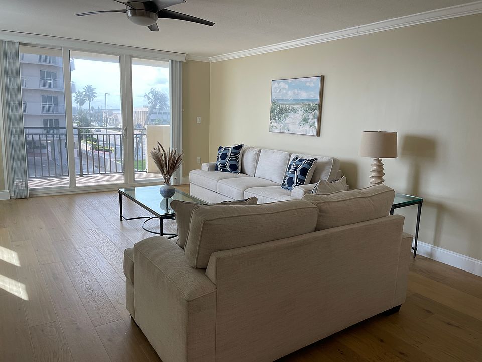 Main room - includes flat screen TV on wall opposite couch