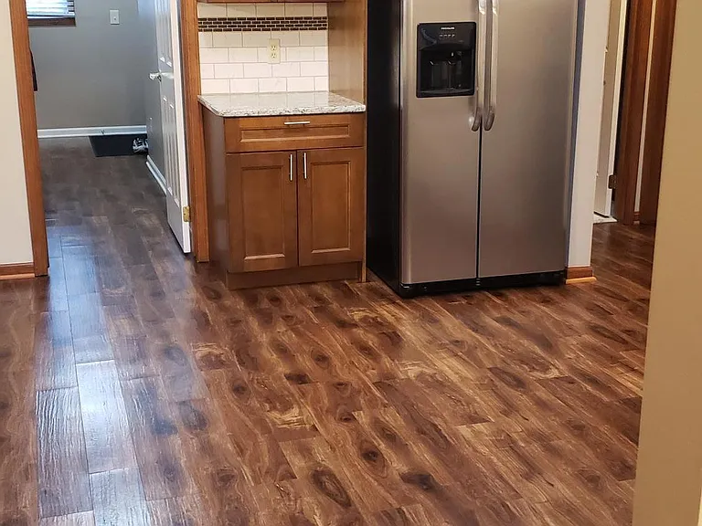 Kitchen and looking towards laundry room and entry from garage