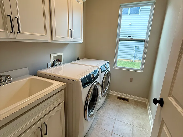 First floor laundry room near garage and kitchen