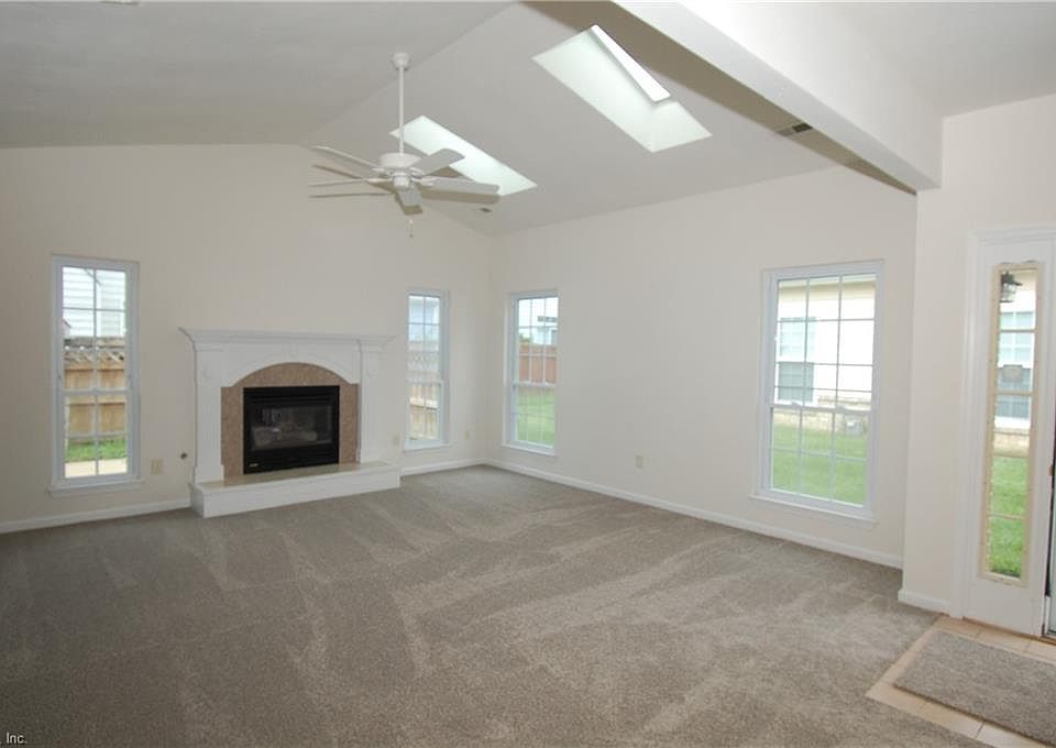 Welcome Home! Dramatic LR with fireplace and skylights