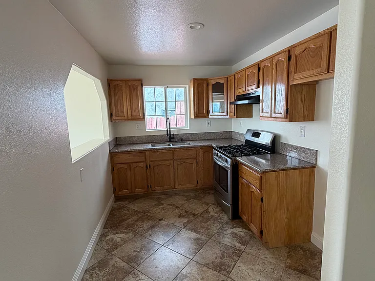 Kitchen space includes a gas stove that can be left for future tenant's use or removed upon request.