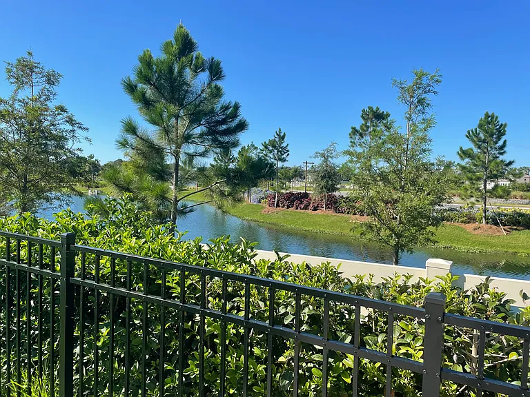 Community entrance and out of back yard fence