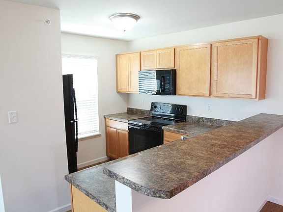 Full kitchen. Fridge, microwave, stove, garbage disposal