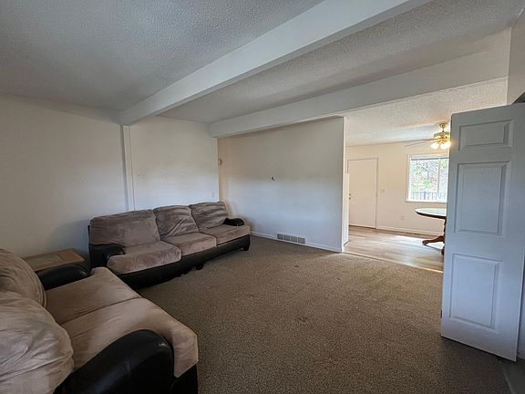 living area connected to the kitchen. This view is from the main entry