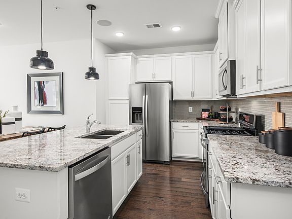 Model Representation - Stunning Kitchen with Stainless Steel Appliances