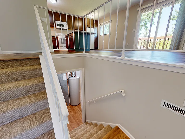 Stairs leading from the upstairs to the basement