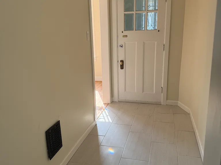 Remodeled entry hallway with new tile.