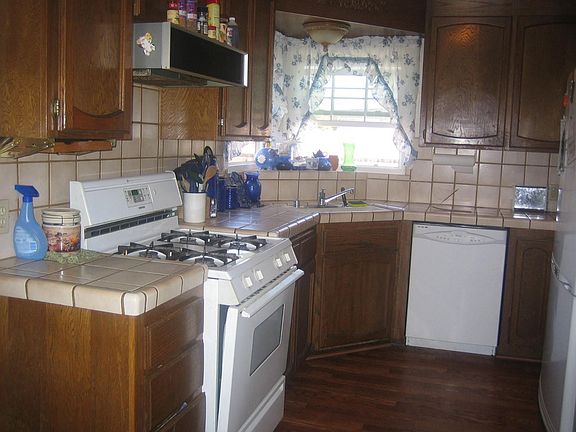 Kitchen has hard wood floors