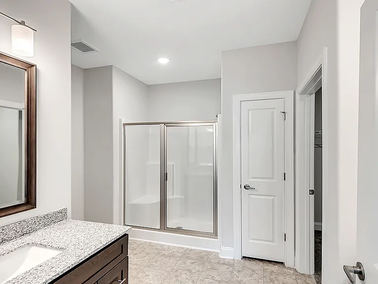 Large bathrooms with granite countertops and large vanities